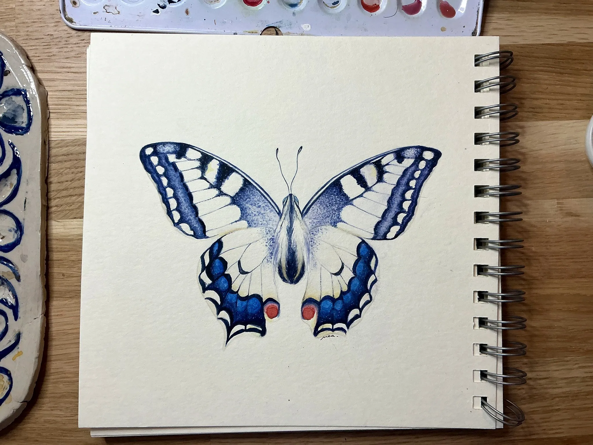 Papillon machaon aux tons bleus à l'aquarelle