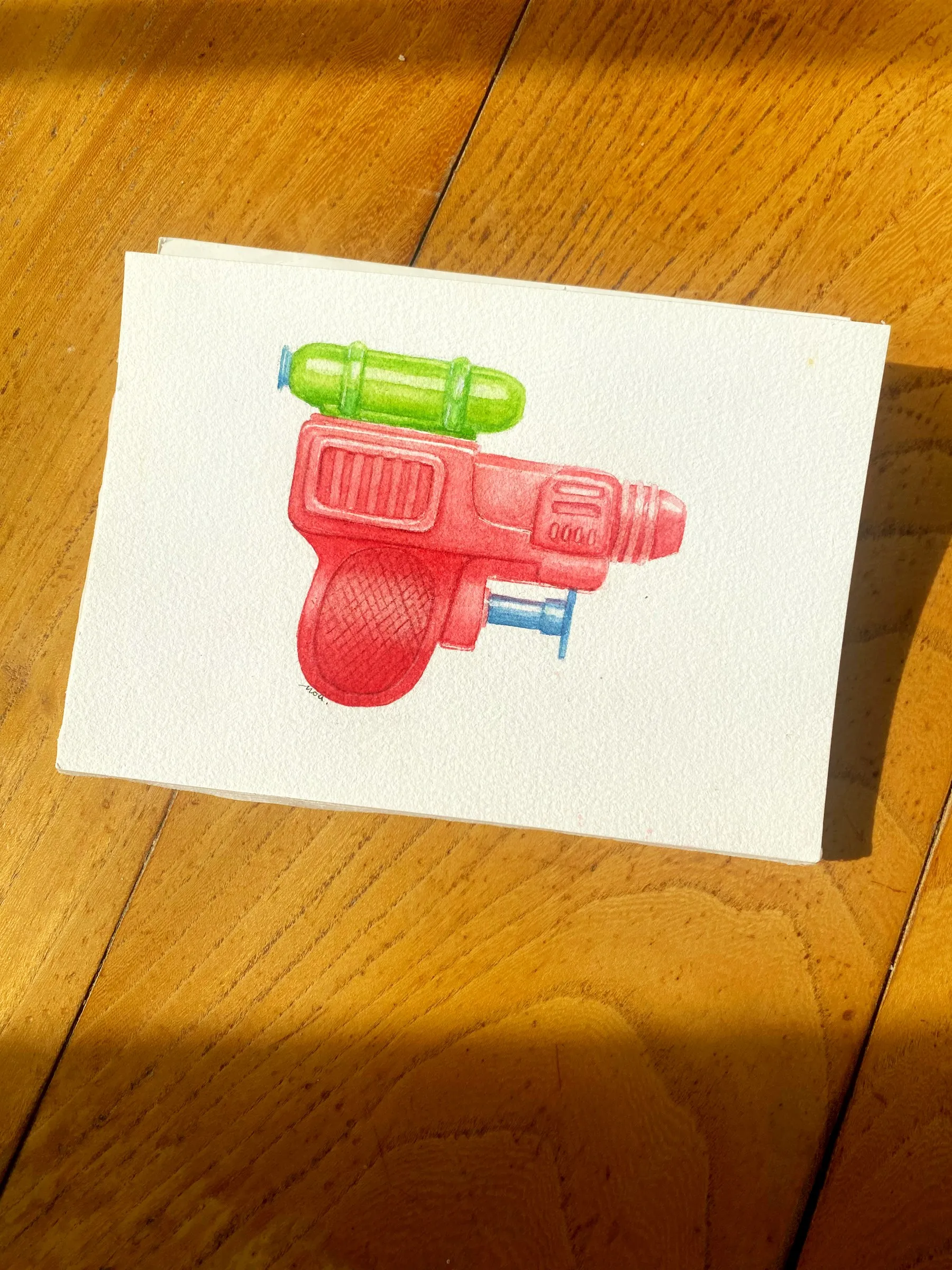 Le pistolet à eau peint, sur le papier